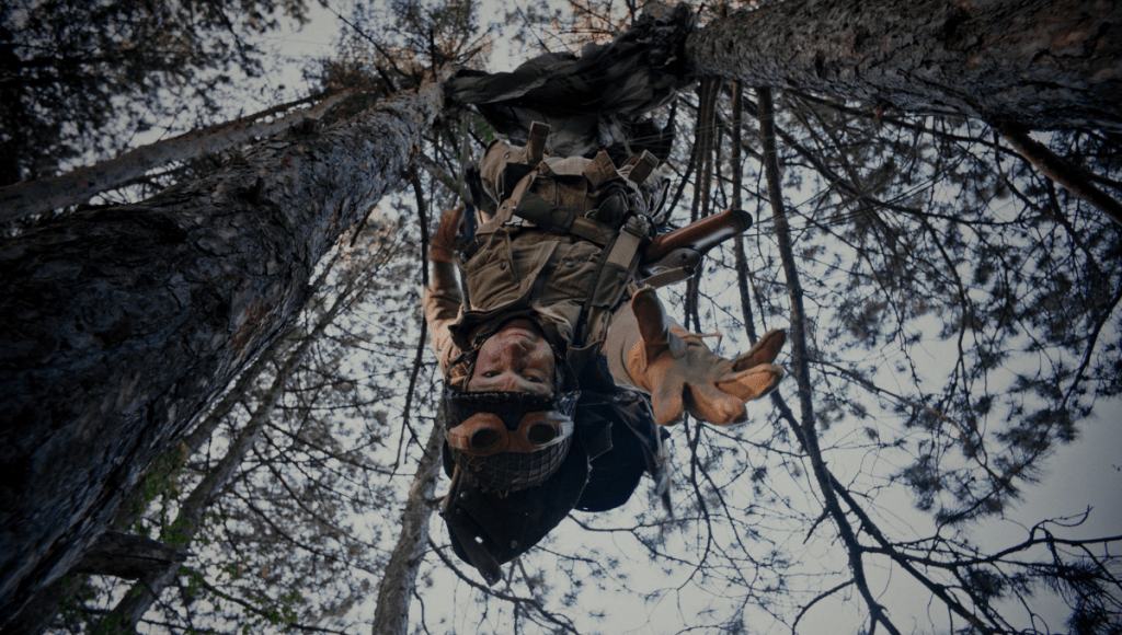 Man hanging from tree