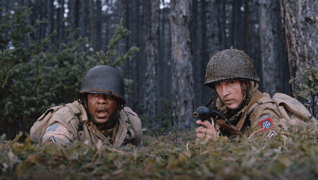 Two men in military uniform in woodland