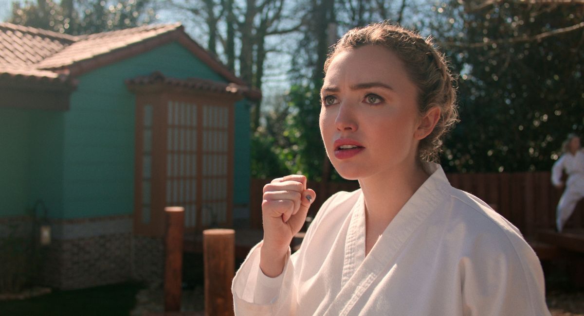 Young woman with blonde hair in karate uniform Peyton List