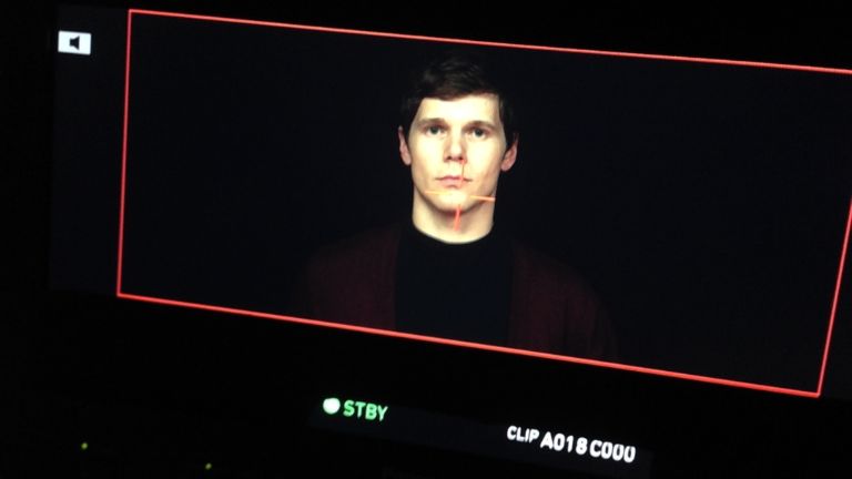A man on a camera monitor