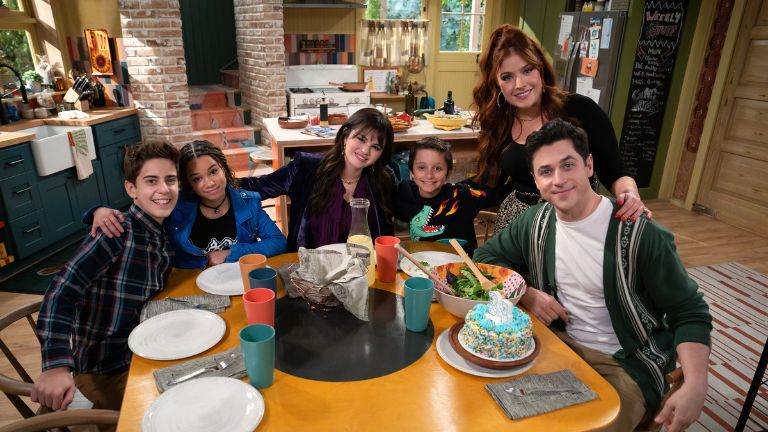 Family sat around a table with food on it